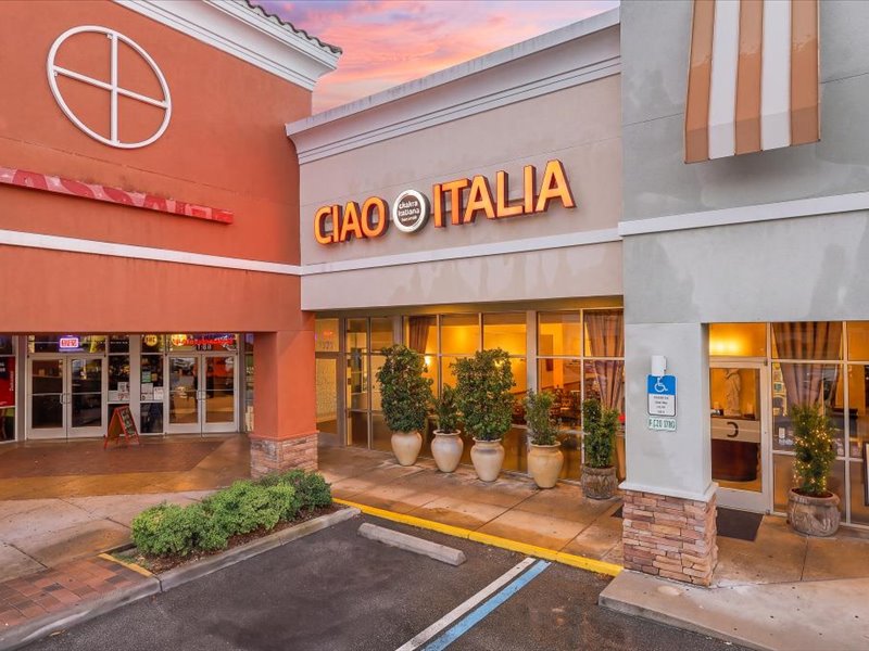 Ciao Italia Ristorante exterior on International Drive Orlando — minutes from the Orange County Convention Center, lit storefront at dusk
