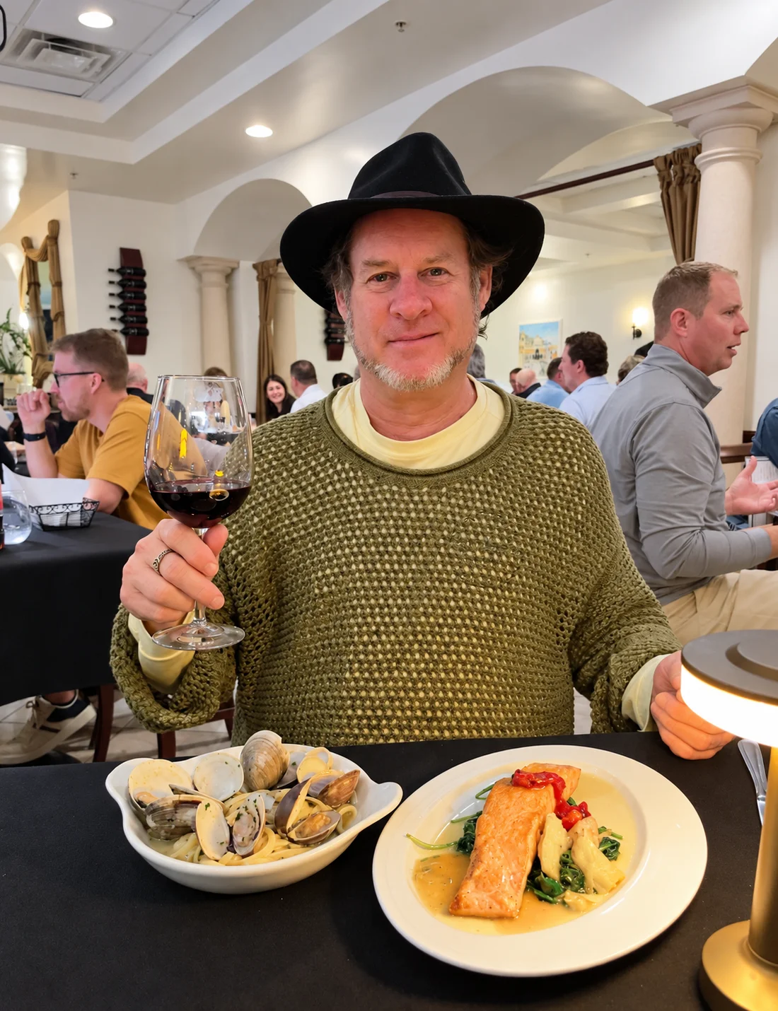 Guest enjoying wine and fresh seafood at Ciao Italia